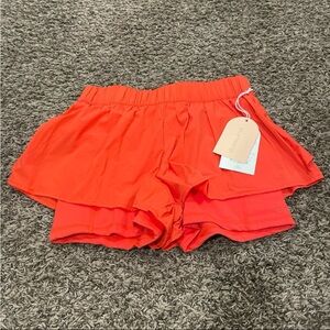 Blogilates NWT ruffle shorts and spicy orange size small